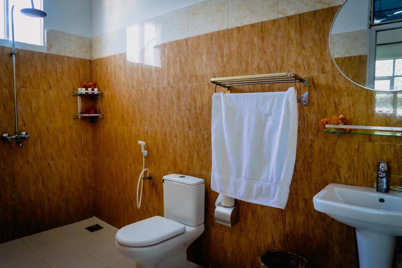 A bathroom with a towel rail and basin
