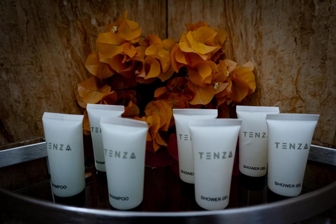 Coffee cups and a fresh flower arrangement set out for breakfast