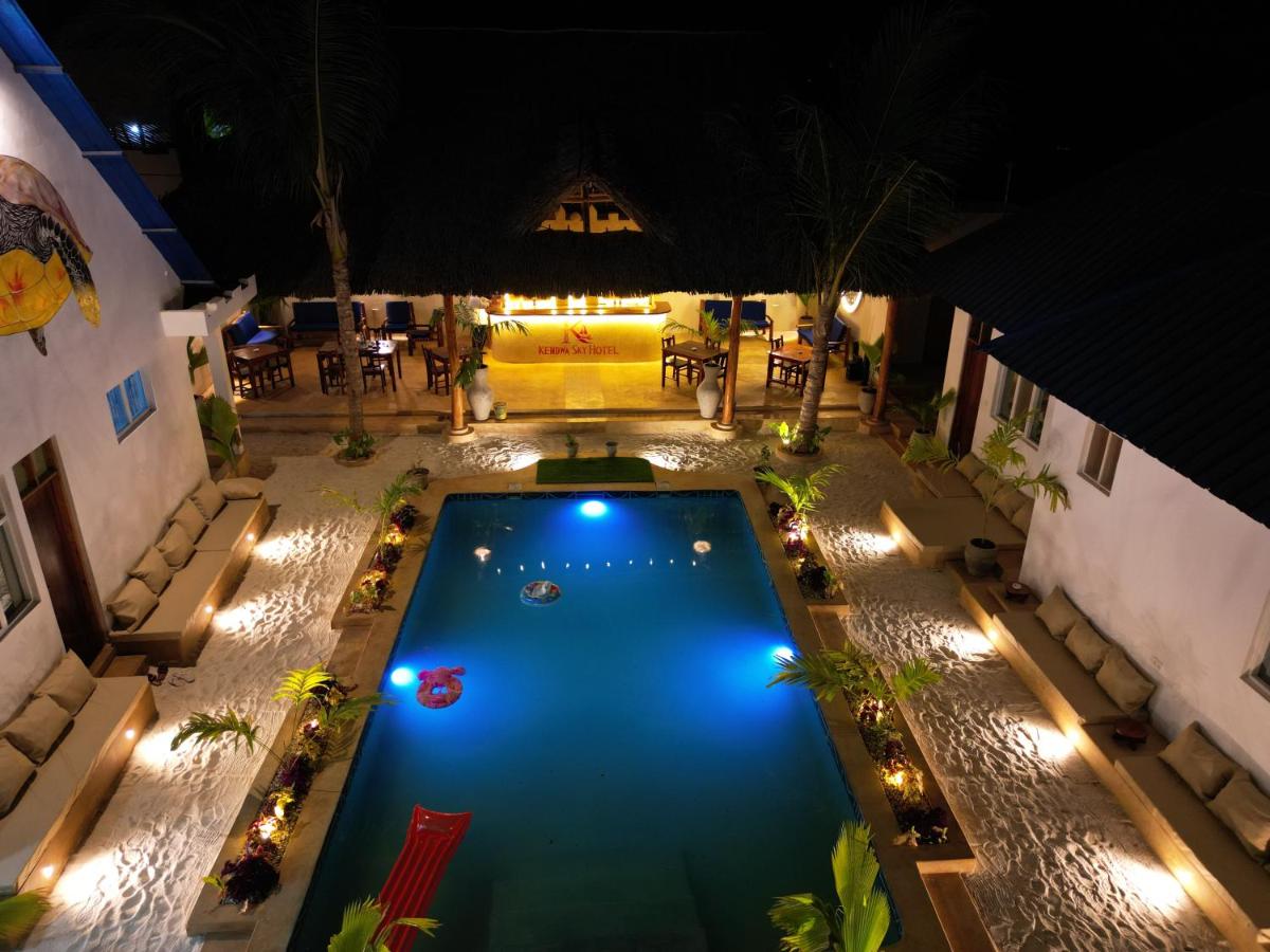 The pool and courtyard seen from above at night