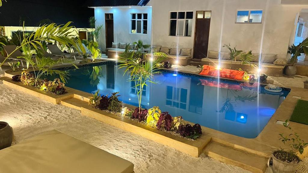 The pool and guest rooms in the last light of the day
