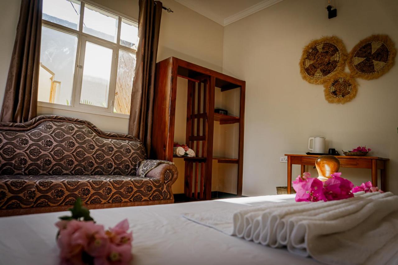 Flower petals arranged across a freshly made bed